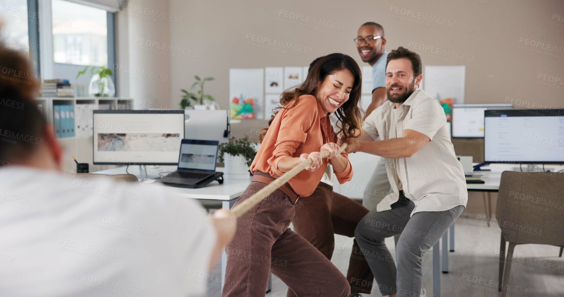 Buy stock photo Business people, teamwork and game with rope in office, physical strength and competition with pull. Employees,  designers and power with tug of war, coordination and synergy for challenge in company