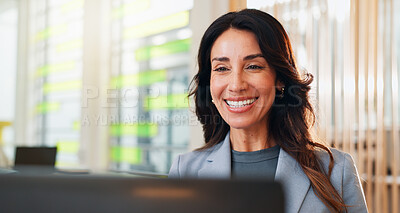 Buy stock photo Finance, laptop and smile with business woman at desk in coworking space for online accounting. Computer, review and satisfaction with happy mature accountant in office for administration or planning