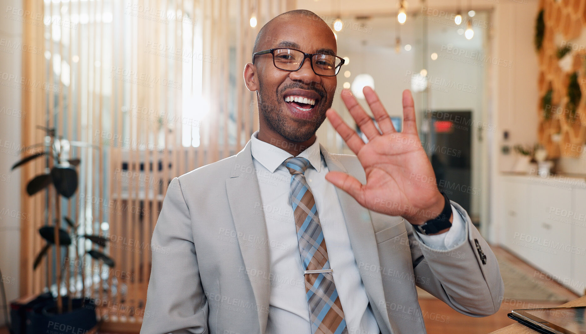 Buy stock photo Black man, wave and portrait in office for video call, welcome and virtual meeting. Business, financial advisor and glasses in agency for introduction, online consultation and webinar POV with smile