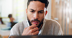 Laptop, problem solving and thinking with business man in coworking space for planning or research. Confused, doubt and frown with employee in workplace for online administration or reporting