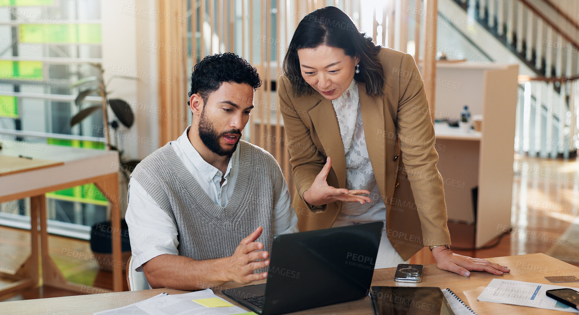 Buy stock photo Collaboration, laptop and problem solving with business people at desk in office for systems training. Assistance, help and question with supervisor talking to employee in workplace for management