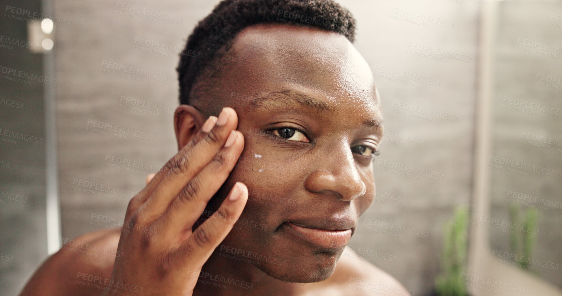 Buy stock photo Eye cream, skincare and face with black man in bathroom for beauty, morning routine and cosmetics. Treatment, hotel resort and cleaning with person at home for grooming, spa glow and self care