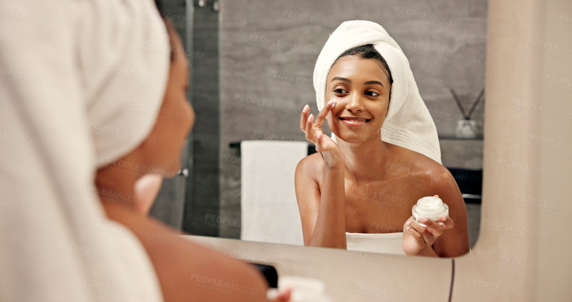 Buy stock photo Mirror, woman and application with cream for skincare, wellness and anti aging benefits in bathroom. Home, reflection and female person with smile for cosmetics, beauty treatment and face moisturizer