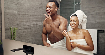 Buy stock photo Cream, skincare and funny with couple in bathroom for beauty, morning routine and cosmetics. Bonding, hotel resort and laughing with man and woman at home for grooming, spa glow and self care