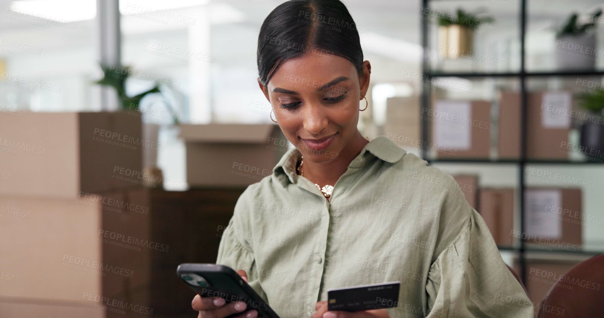 Buy stock photo Small business, office and woman with card, smartphone and budget for stock in warehouse and boxes. Purchase, entrepreneur and person with credit for supplies, ecommerce or finance for payment