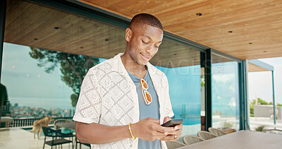 Buy stock photo Black man, smile and outdoor with mobile for social media, travel planning and contact at hotel. Person, phone or typing at resort for status update, accommodation review or writing blog on platform