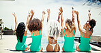 Bachelorette, beach resort and celebration with friends outdoor together for holiday or vacation. Back, bikini or hotel pool and woman and bridesmaids drinking champagne with hands raised at resort