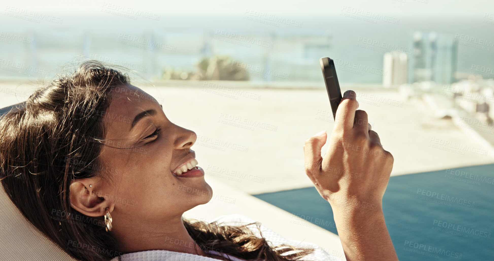 Buy stock photo Happy woman, relax and phone at hotel for travel, social media update or accommodation review. Influencer, summer vacation and mobile on resort rooftop for booking app, follower interaction or luxury