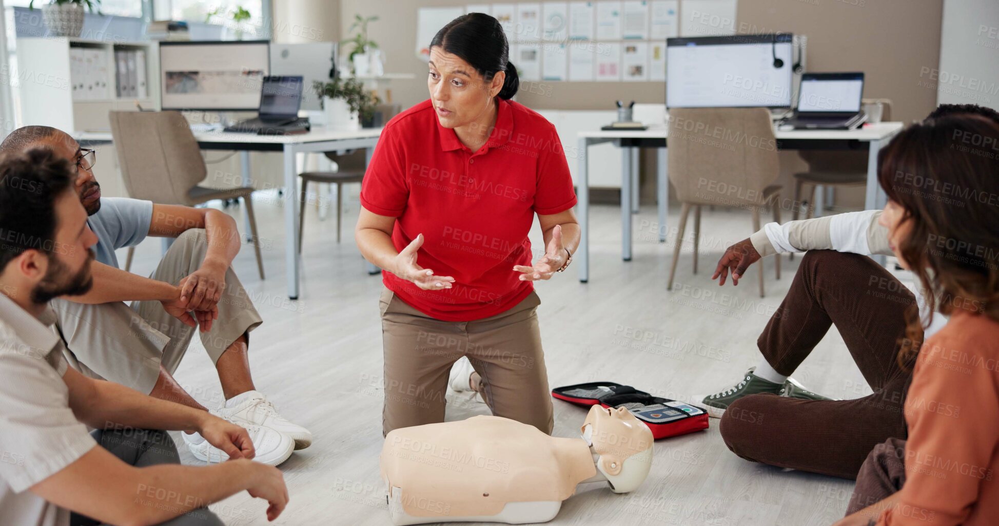 Buy stock photo First aid, training and people in office for safety compliance, company healthcare or medical demonstration. Paramedic course, cpr and teaching emergency rescue technique with mannequin in business