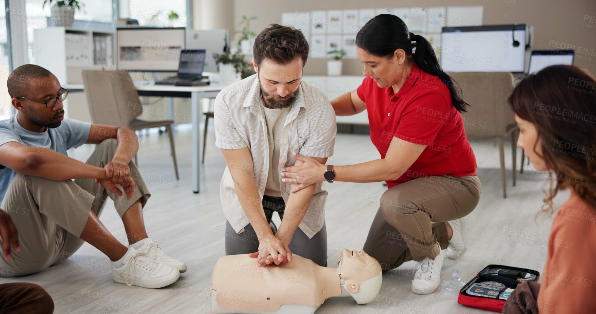 Buy stock photo First aid, learning cpr and people with mannequin for safety compliance, health or chest compression for breathing. Paramedic course, medical and teaching group emergency rescue technique in office