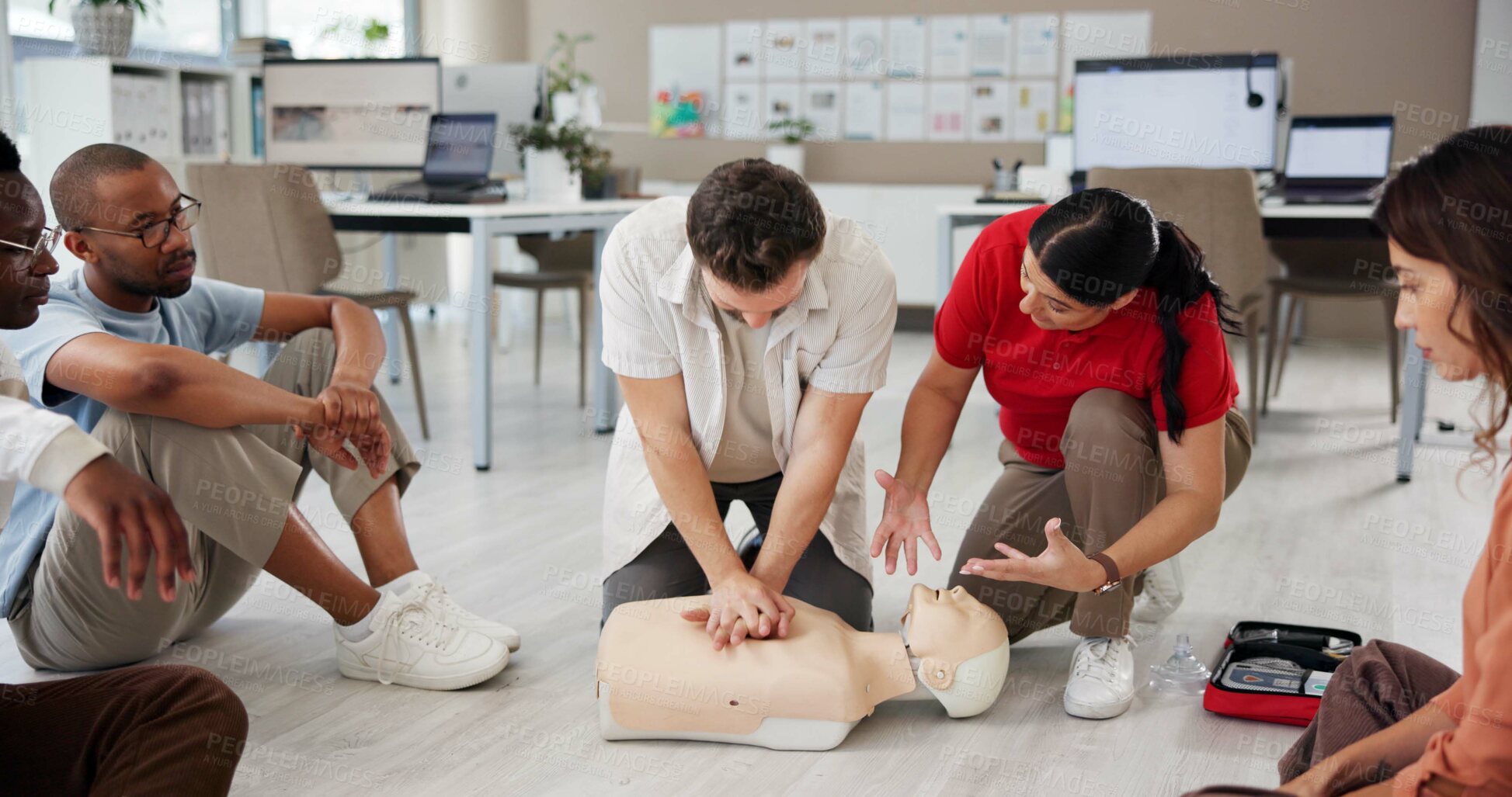 Buy stock photo First aid, learning cpr and group with dummy for safety compliance, health and chest compression for breathing. Paramedic course, medical and teaching people emergency rescue technique in office