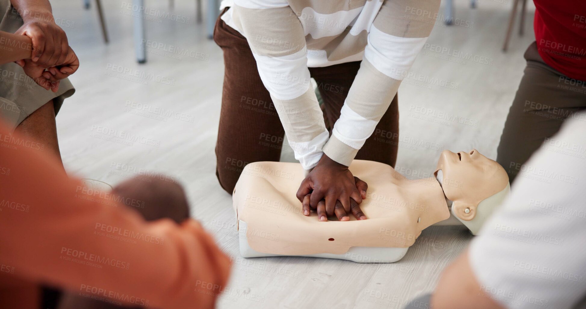 Buy stock photo People, dummy or hands in office for first aid, CPR workshop or chest compression lesson. Colleagues, emergency practice or mannequin in agency for life saving procedure, demo and employee engagement