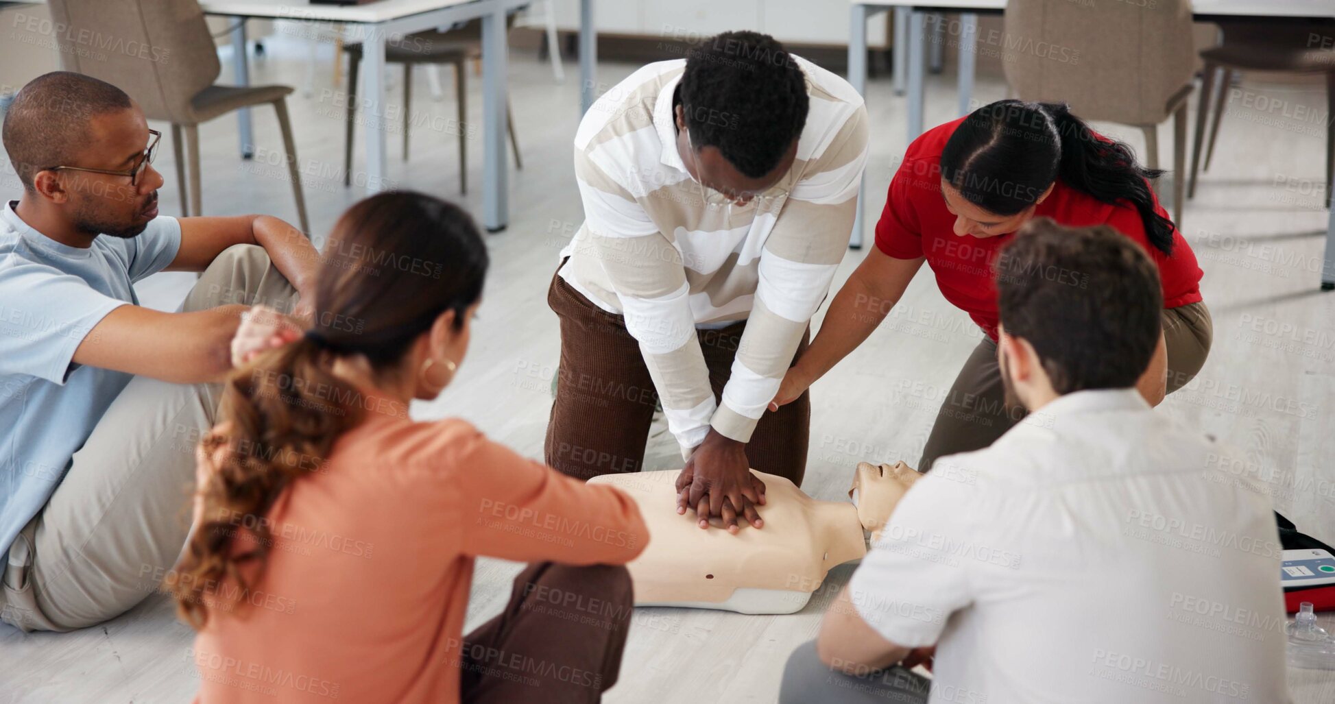Buy stock photo People, dummy and first aid in office for learning, CPR workshop or chest compression lesson. Design team, emergency practice or mannequin in agency for life saving procedure with employee engagement