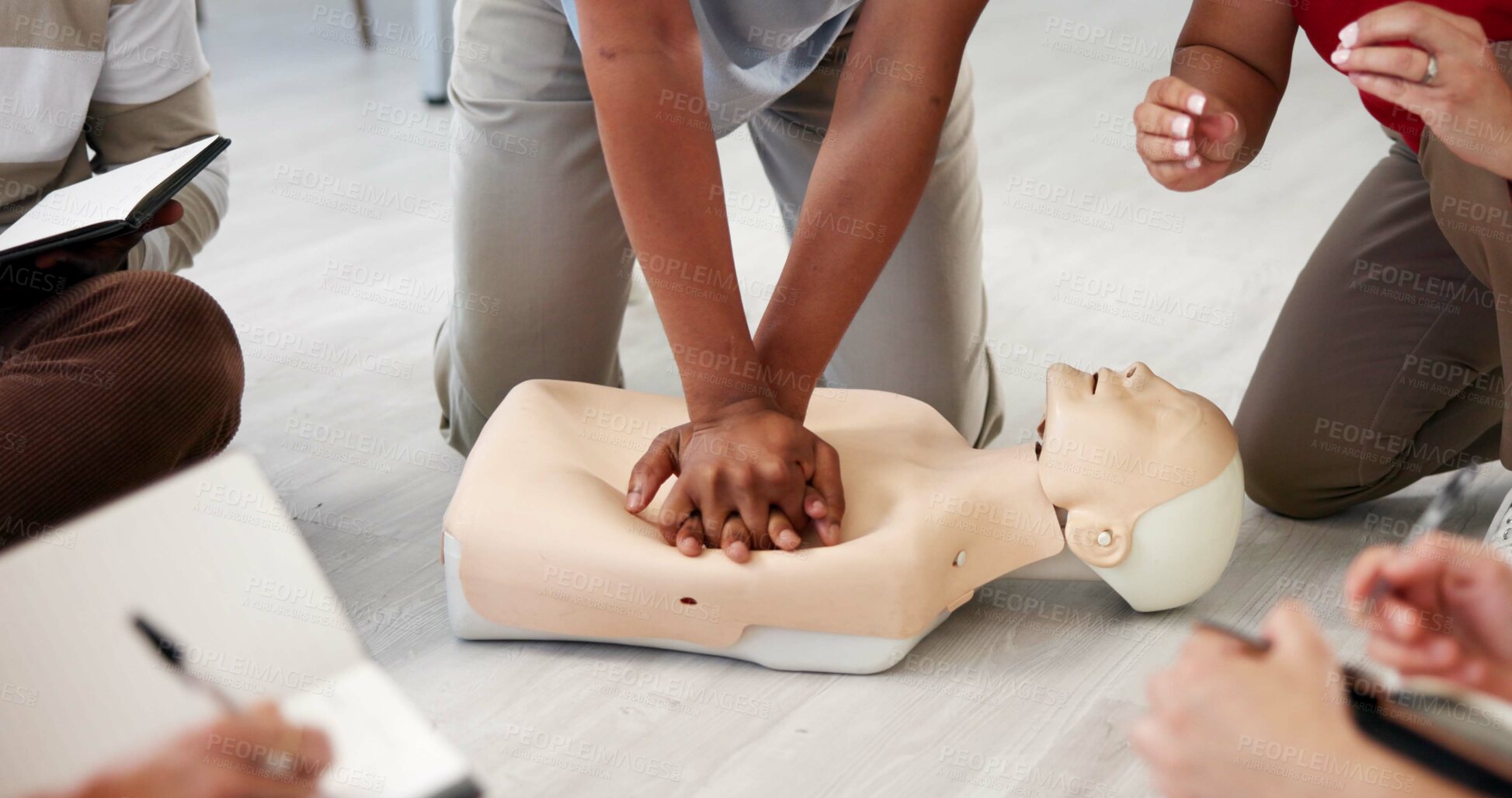 Buy stock photo People, dummy or hands in office for CPR, first aid workshop or chest compression lesson. Colleagues, emergency practice or mannequin in agency for life saving procedure, notes or employee engagement