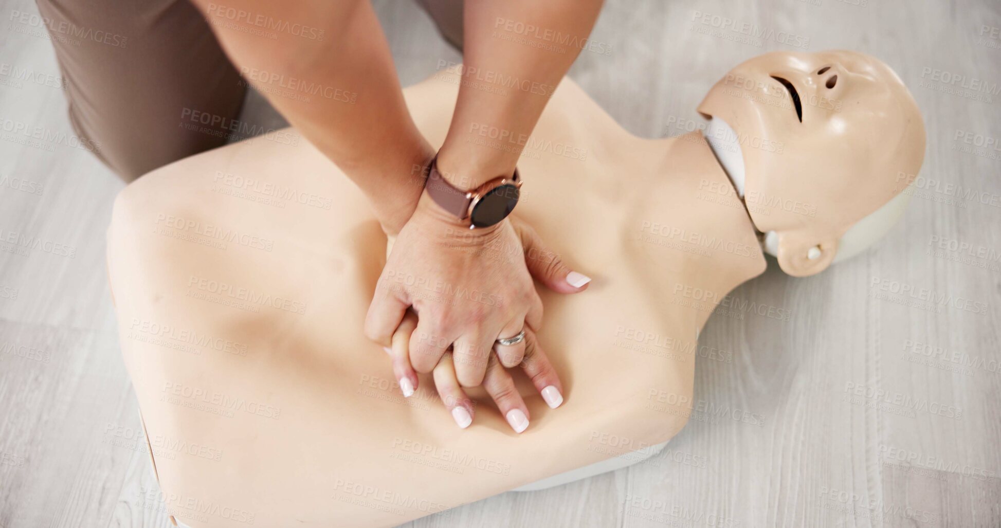 Buy stock photo Mannequin, cpr and hands with above of person for first aid workshop, cardiac arrest or safety protocol. Healthcare medical training and heart attack rescue with chest compression in paramedic course
