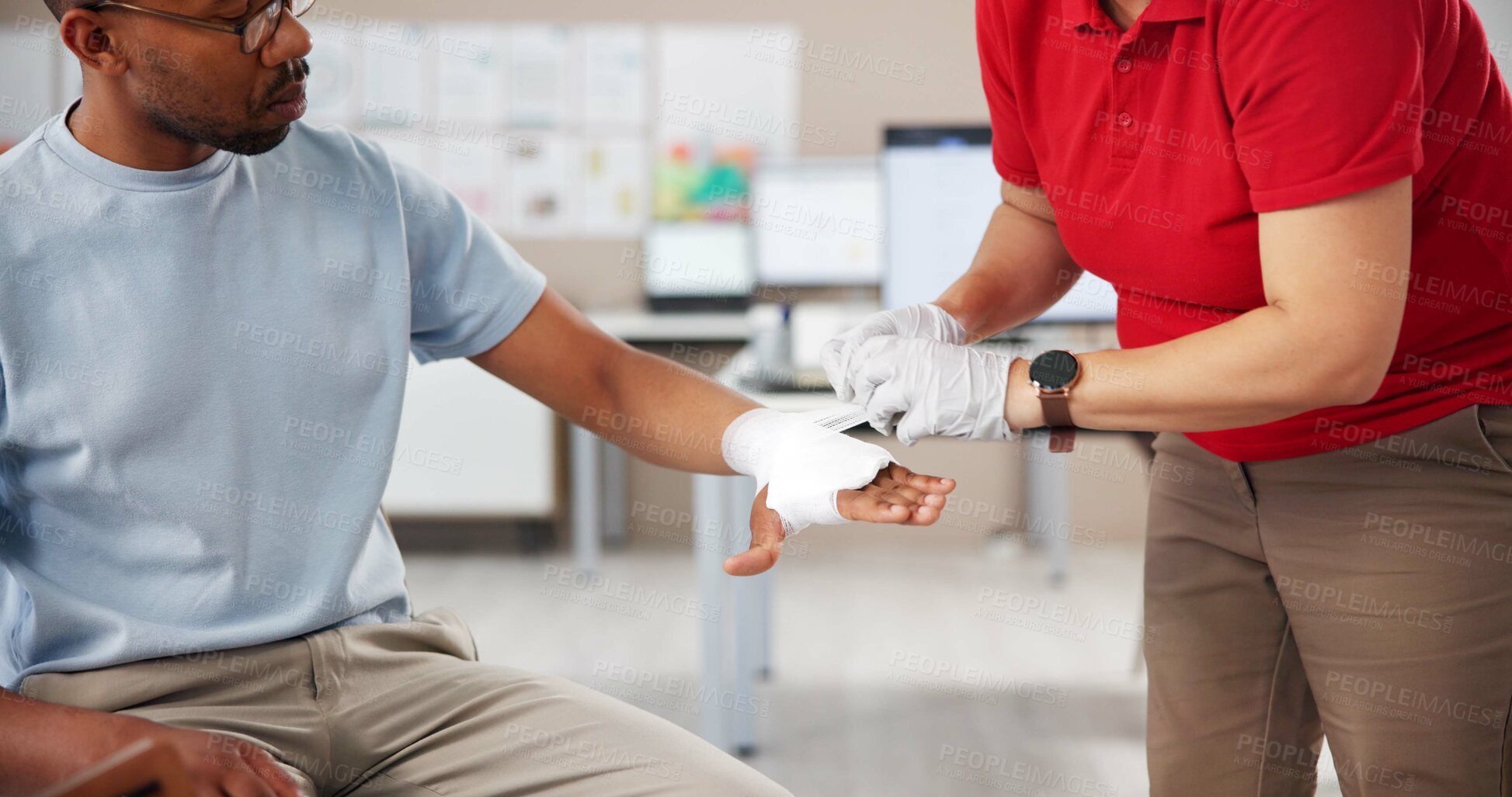 Buy stock photo Hands, people and first aid with bandage, teaching or tutorial with care, attention or help at office. Paramedic, coach and staff for treatment, wound or burn injury with training course in workplace