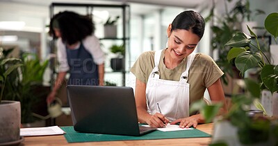 Buy stock photo Laptop, online order and writing with woman in flower shop for sale of floral arrangements. Computer, documents and plant nursery with happy florist at desk in office of small business for delivery