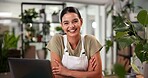 Arms crossed, laptop and smile with woman in flower shop for online order or sale of floral decor. Computer, desk and plant nursery with happy florist in office of small business for delivery