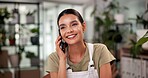 Woman, florist and happy for phone call at store with contact, listen or deal with compost supplier. Person, smartphone and smile for conversation, negotiation and order for organic plants at shop