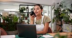 Laptop, memo and phone with woman in flower shop for reminder of floral sale or schedule. Computer, plant nursery and voice recording with florist at desk in office of small business for ecommerce