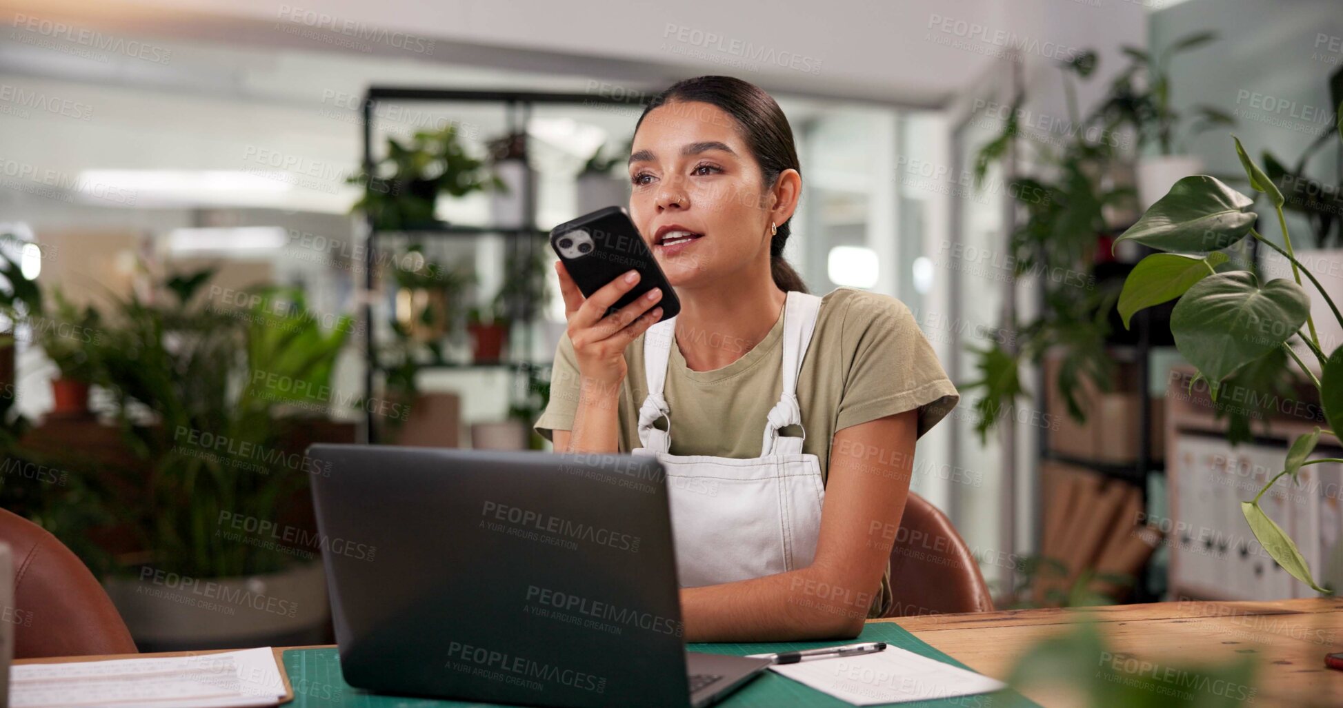 Buy stock photo Laptop, memo and phone with woman in flower shop for reminder of floral sale or schedule. Computer, plant nursery and voice recording with florist at desk in office of small business for ecommerce