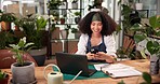 Documents, laptop and phone with woman in flower shop for online order of floral decor. Computer, smile and typing with happy florist in plant nursery for small business delivery or inventory