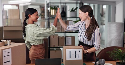 Buy stock photo Logistics, entrepreneur and people with boxes, high five and celebration for partnership in warehouse. Shipping, supply chain and happy for stock in small business, collaboration and achievement