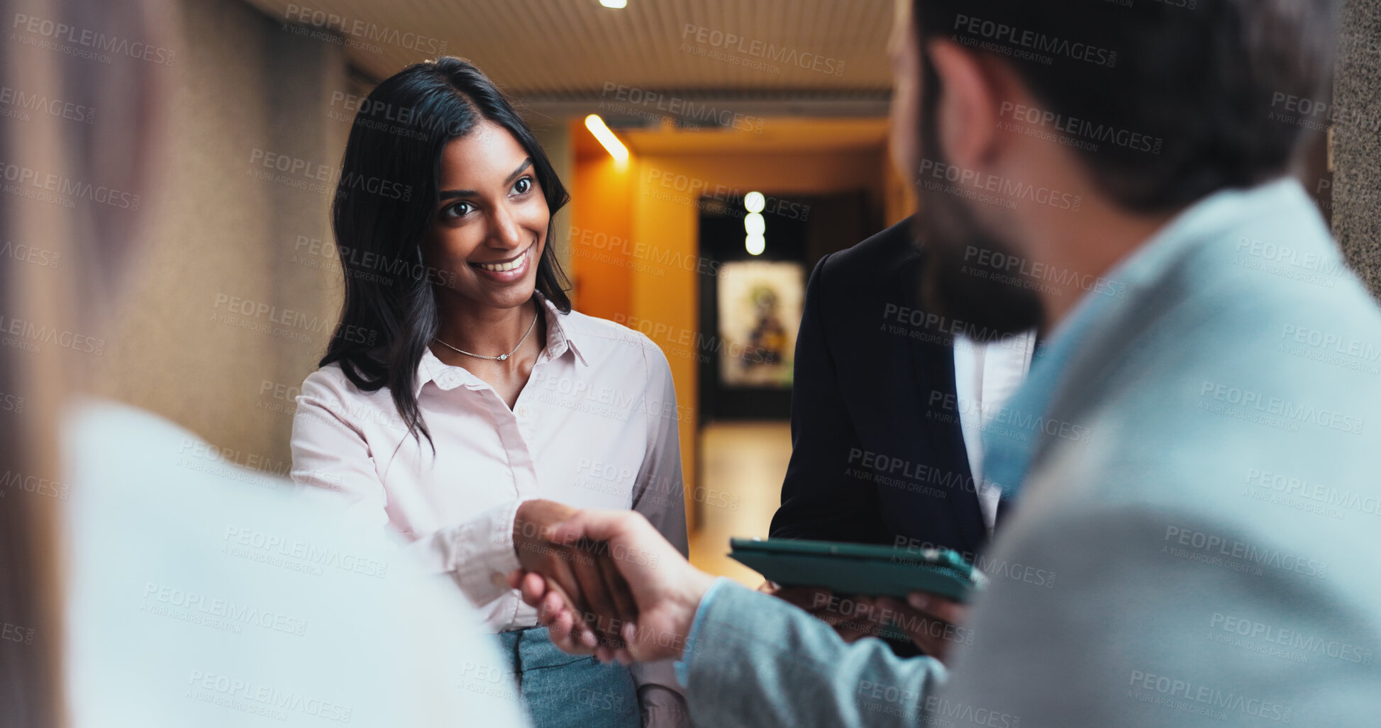 Buy stock photo Smile, business people and handshake in office for introduction, b2b partnership or meeting. Shaking hands, cooperation and greeting team, welcome and hello at seminar hallway in hotel lobby at night