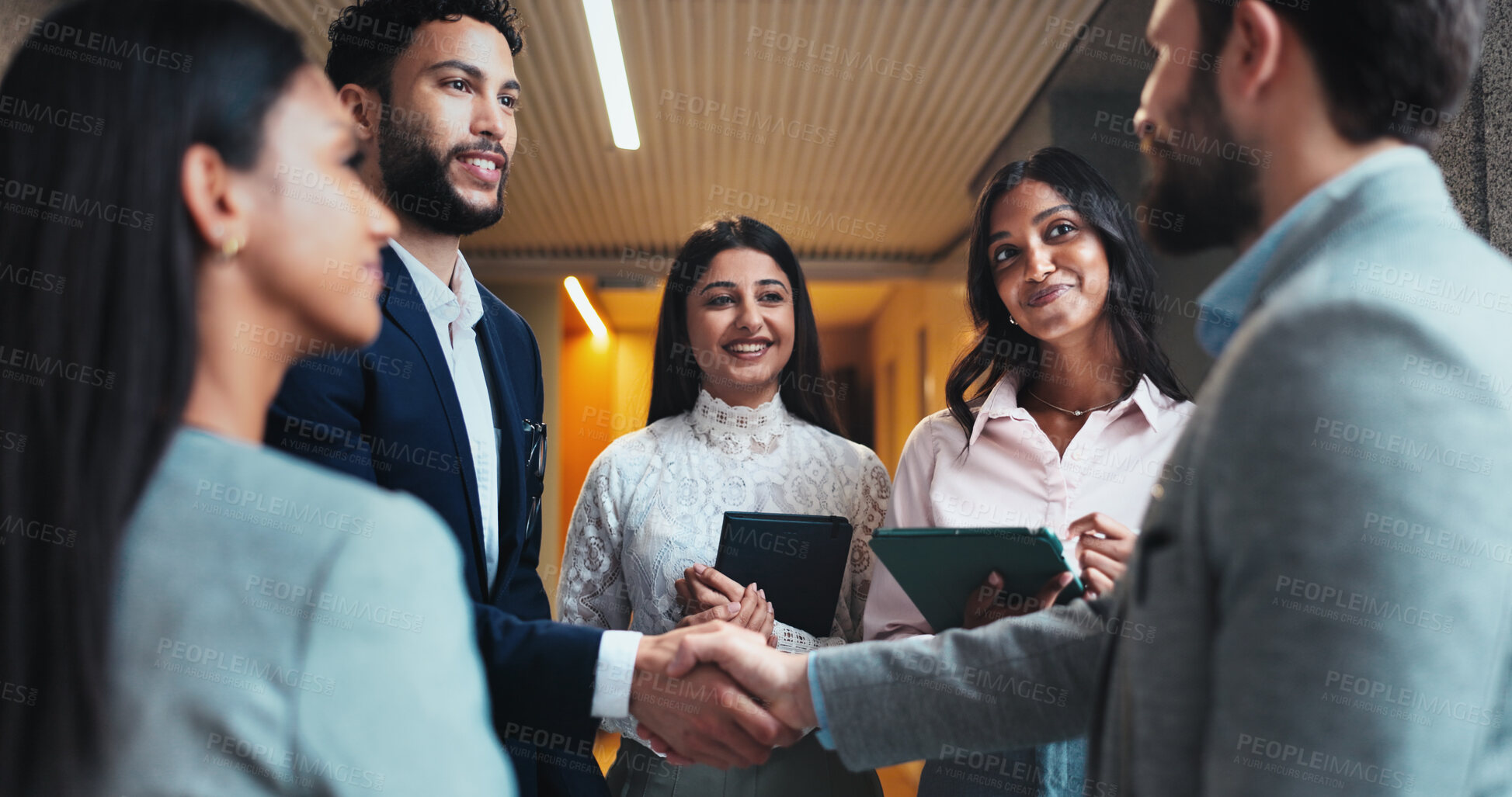 Buy stock photo Group, business people and shaking hands in office for agreement, b2b partnership and meeting. Handshake, smile and team introduction, welcome and hello at seminar hallway in hotel lobby at night
