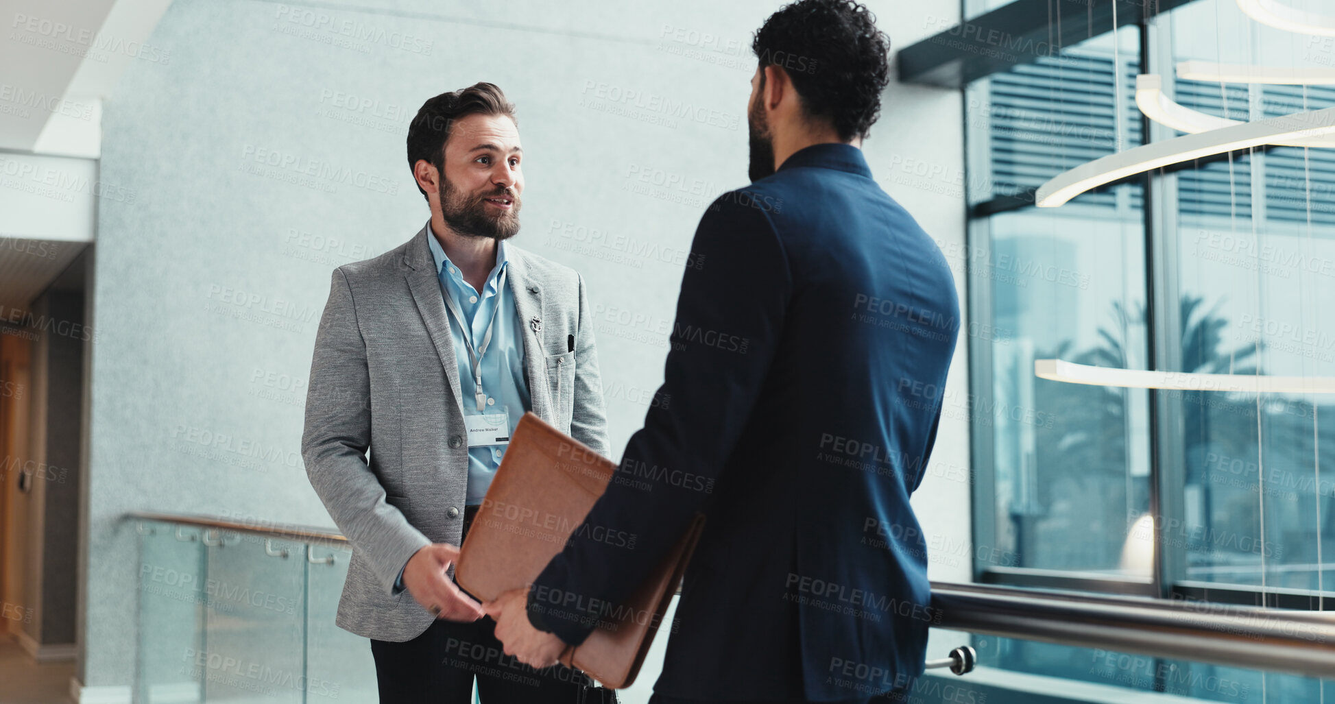 Buy stock photo Collaboration, conversation and planning with business people in corridor of office for discussion, Documents, partnership and update with employee men meeting in professional workplace for feedback