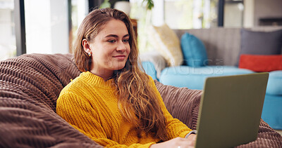 Buy stock photo Laptop, relax and woman on bean bag in home with online university application for scholarship. Happy, computer and female student reading email for college education acceptance on sofa in apartment.