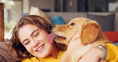 Buy stock photo Home, licking and woman with dog, smile and bonding together with care, hug and affection. Apartment, pet and person on sofa, comfort and domestic animal with embrace, playful and happiness in lounge