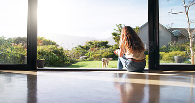 Buy stock photo Relax, home and woman watching dog play in backyard for animal exercise, health and fun. Companion, adoption and back of female person with puppy pet outdoor in garden for adjusting to new house.