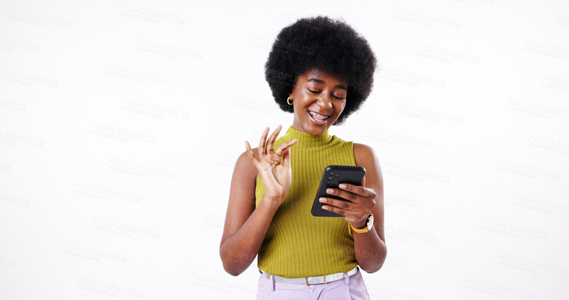 Buy stock photo Phone, happy and black woman in studio reading post on social media for content creation. Cellphone, creative and African female influencer browsing on celebrity news blog by white background.