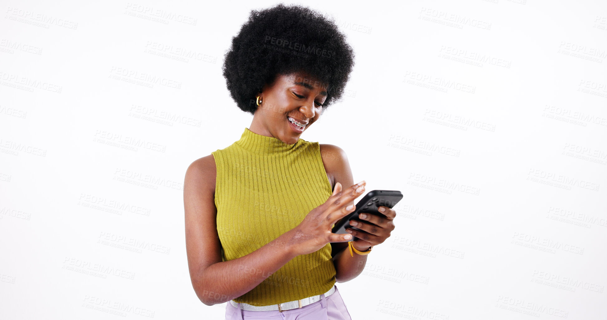 Buy stock photo Phone, happy and black woman in studio typing post on social media for content creation. Cellphone, creative and African female influencer reading celebrity news blog on website by white background.
