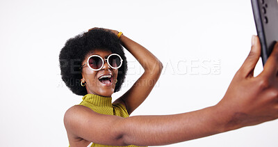 Buy stock photo Excited black woman, afro and selfie for fashion, style and influencer post on social media. Sunglasses, picture and trendy model with photo, cool blog and content creation on white studio background