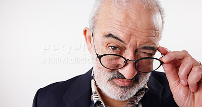 Buy stock photo Elderly man, portrait or wink with glasses for secret, gossip or optometry deal at studio mockup. Senior person, eye care or emoji on white background space for thank you, lens promotion or new frame
