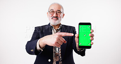 Buy stock photo Pointing, green screen and mature man with smartphone, space or tips for presentation of mobile. White background, studio and advertising of web application, tracking markers or display of technology