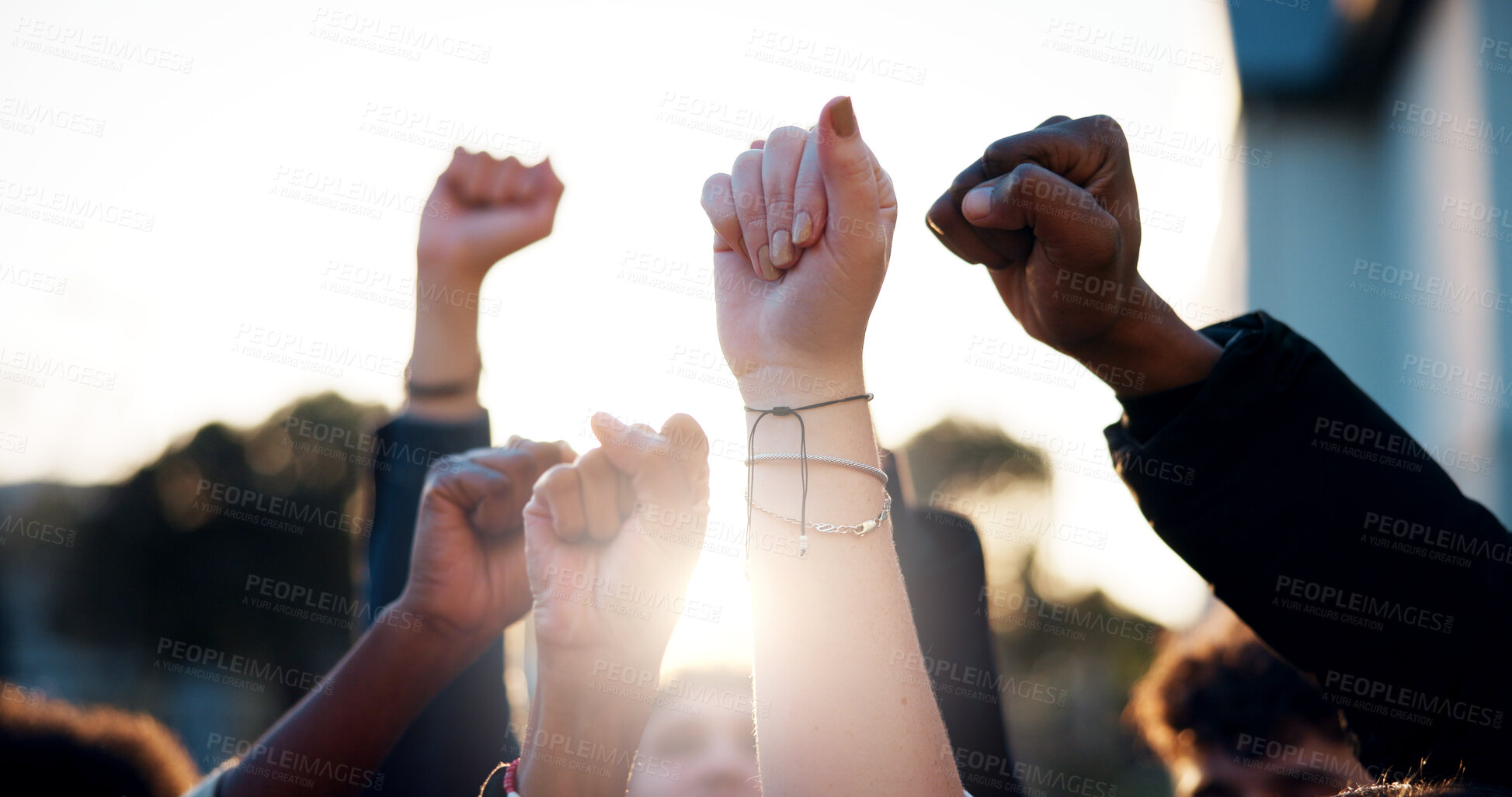 Buy stock photo Hands, fist and students with protest outdoor for education riot, university equality and change law. Group, people and power with call to action for free learning, society support and racism justice