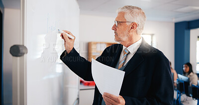 Buy stock photo Mature man, lecturer and writing with whiteboard in classroom for physics lesson, teaching or introduction. Male person, professor or teacher with curriculum for physical science or higher education