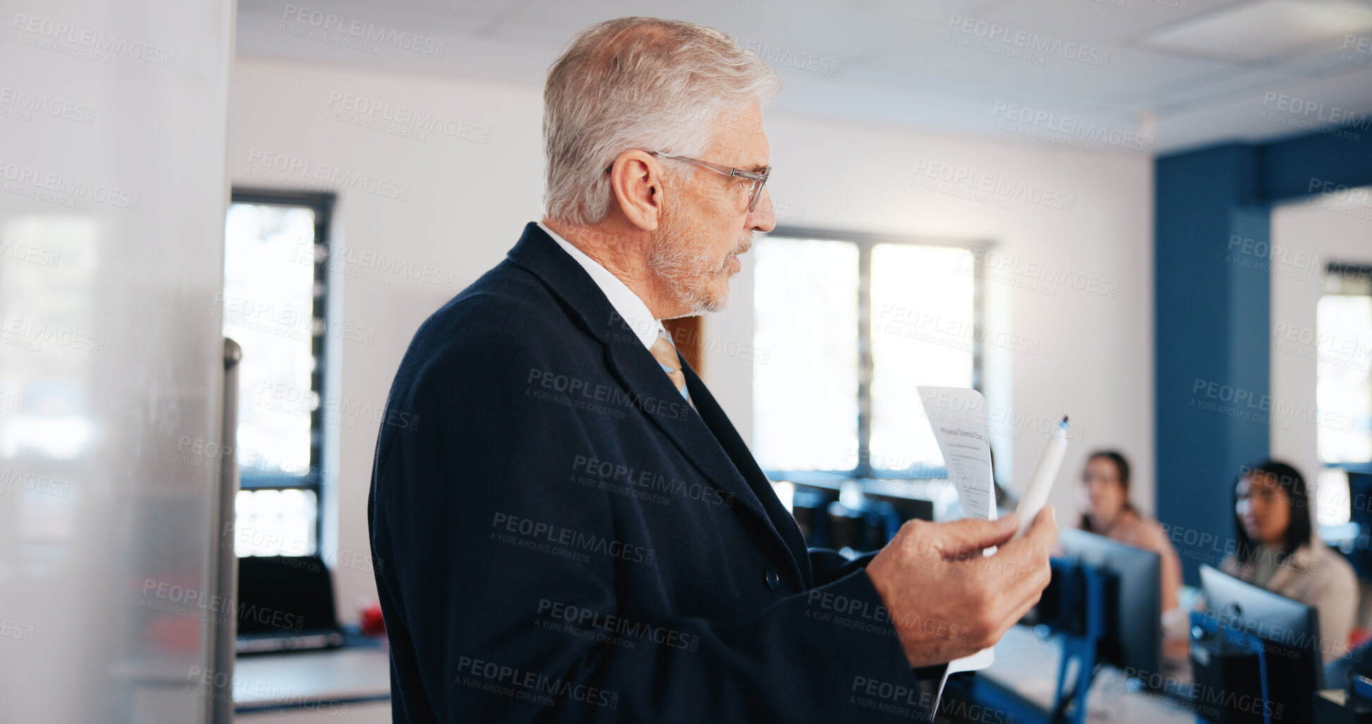 Buy stock photo Mature man, teacher and lesson with whiteboard in classroom for presentation, education or learning. Male person, professor or lecturer teaching with curriculum or students for higher education