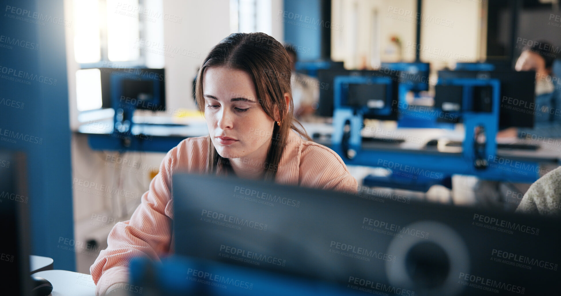 Buy stock photo Girl, student and typing with computer for online assessment, test or exam in classroom. Female person, learner or academic candidate studying on PC for virtual learning, education or IT assignment