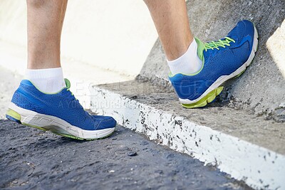 Buy stock photo Cropped image of a runner stretching his calves