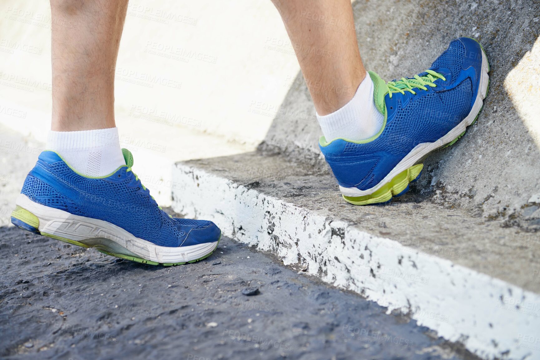 Buy stock photo Cropped image of a runner stretching his calves
