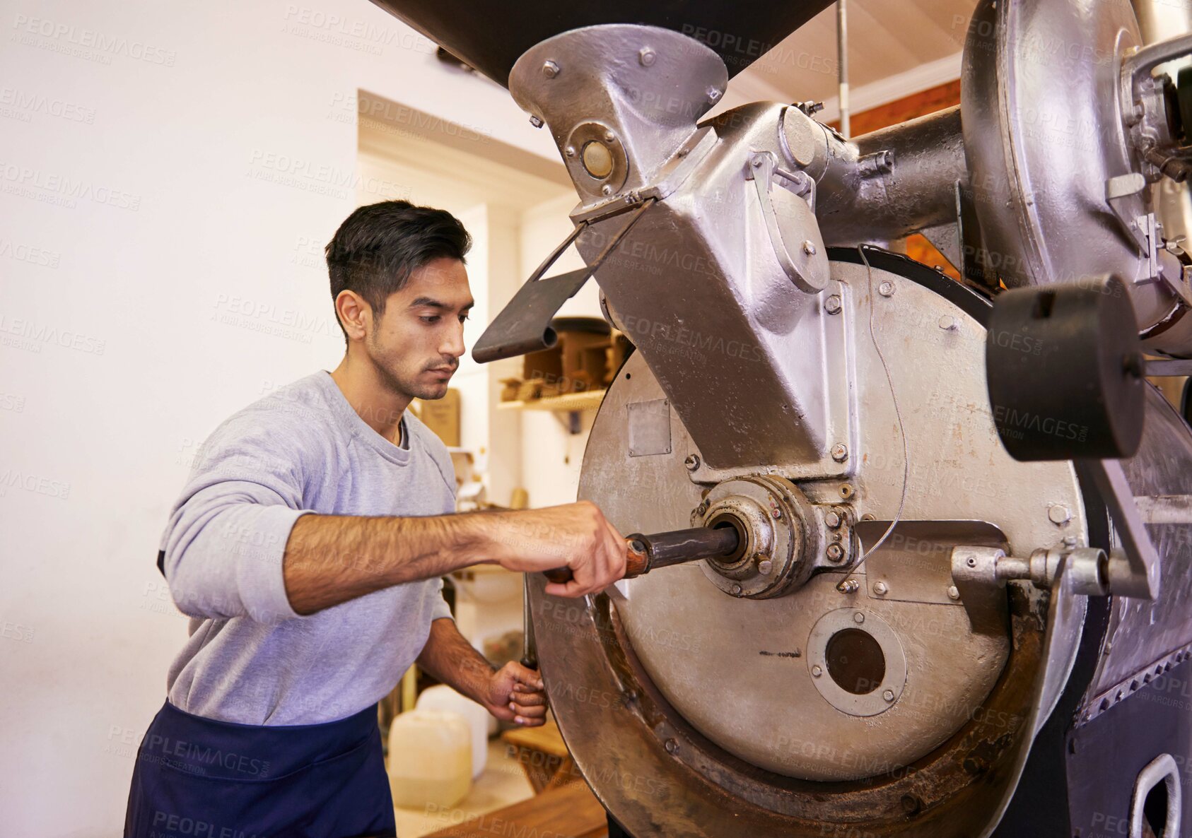 Buy stock photo Man, machine and industry for grinding coffee with roast, process and flavor for export in factory. Person, employee and tools for caffeine, beans or press with manufacturing at warehouse in Colombia
