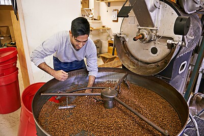 Buy stock photo Coffee, quality control and man with machine for roasting with blending, production and small business. Entrepreneur, barista or person with beans at cafe, sustainable startup and espresso process