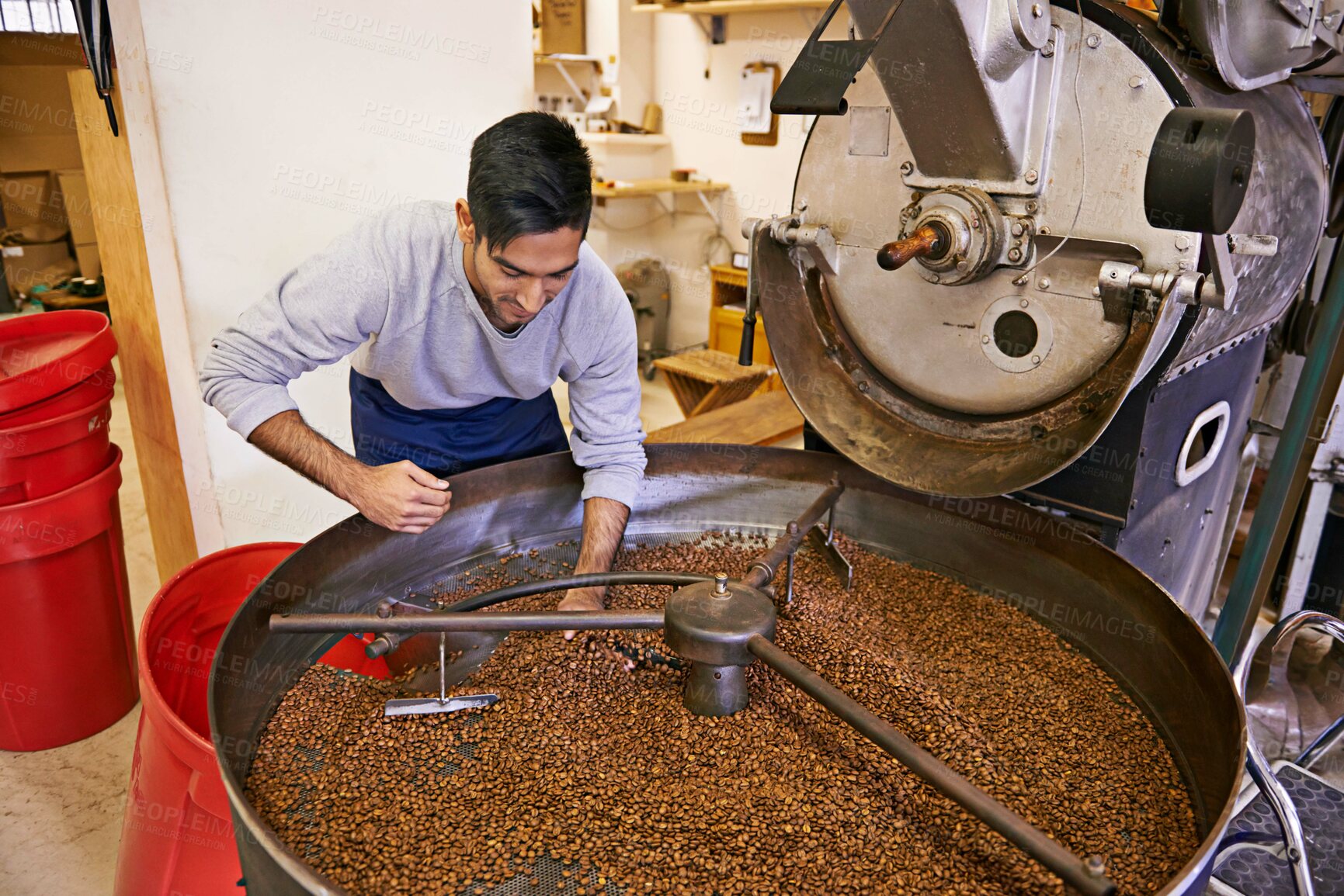 Buy stock photo Coffee, quality control and man with machine for roasting with blending, production and small business. Entrepreneur, barista or person with beans at cafe, sustainable startup and espresso process