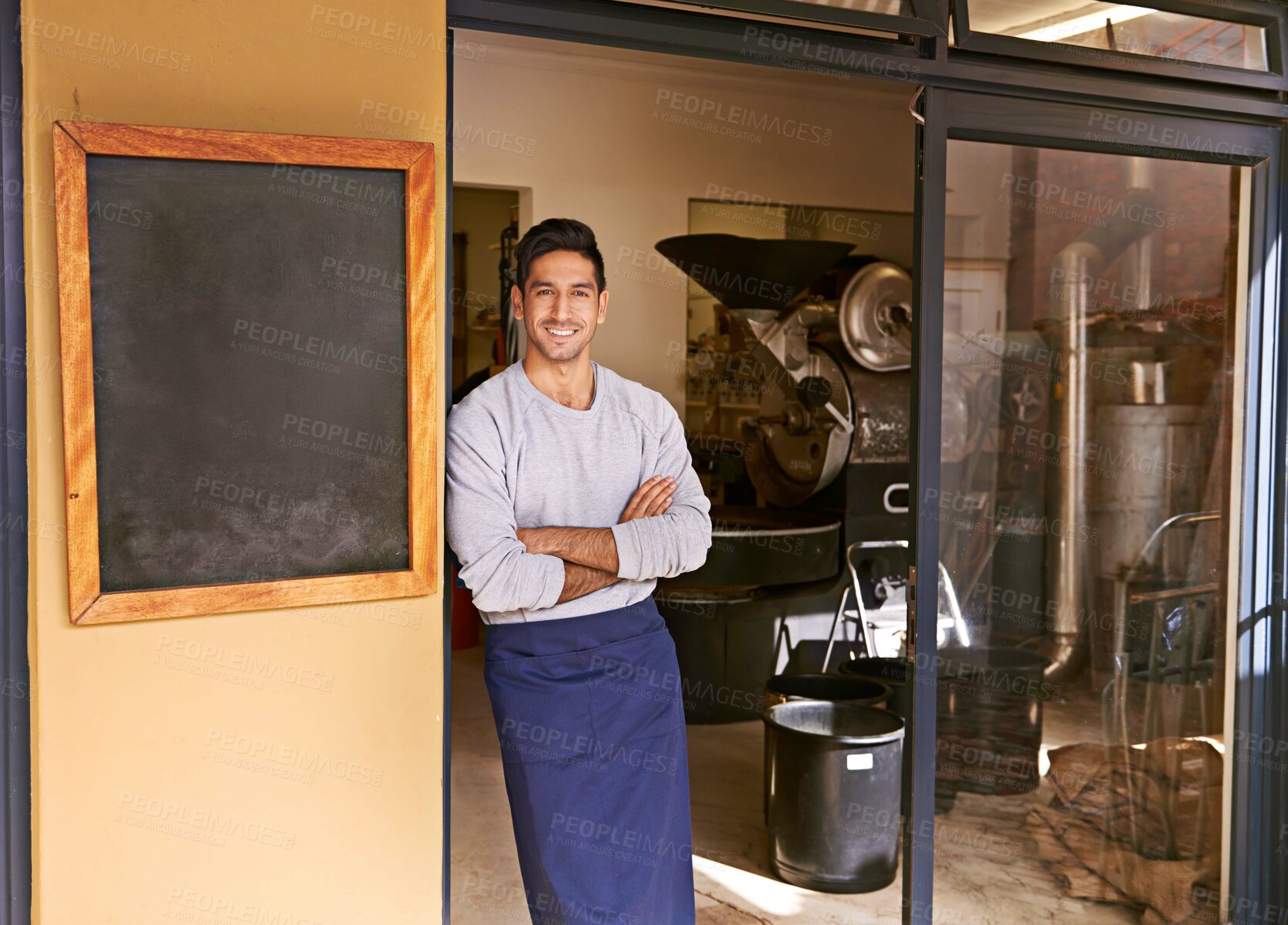 Buy stock photo Barista, coffee shop and man in portrait for small business, owner with arms crossed and smile for service. Entrepreneur, cafe and drink store with hospitality, professional and server in industry