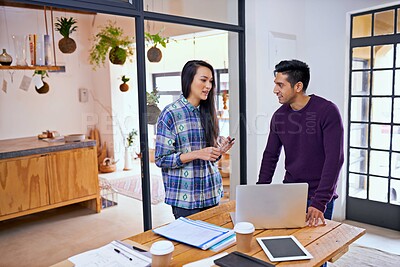 Buy stock photo Creative people, laptop and discussion with team in planning or meeting for project together at the office. Happy man and woman working on computer with paperwork for schedule or tasks at workplace