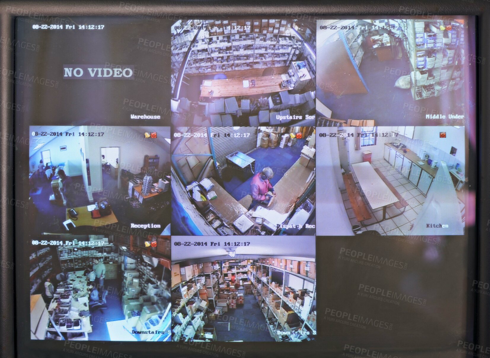 Buy stock photo Shot of a close circuit tv monitor watching a factory floor